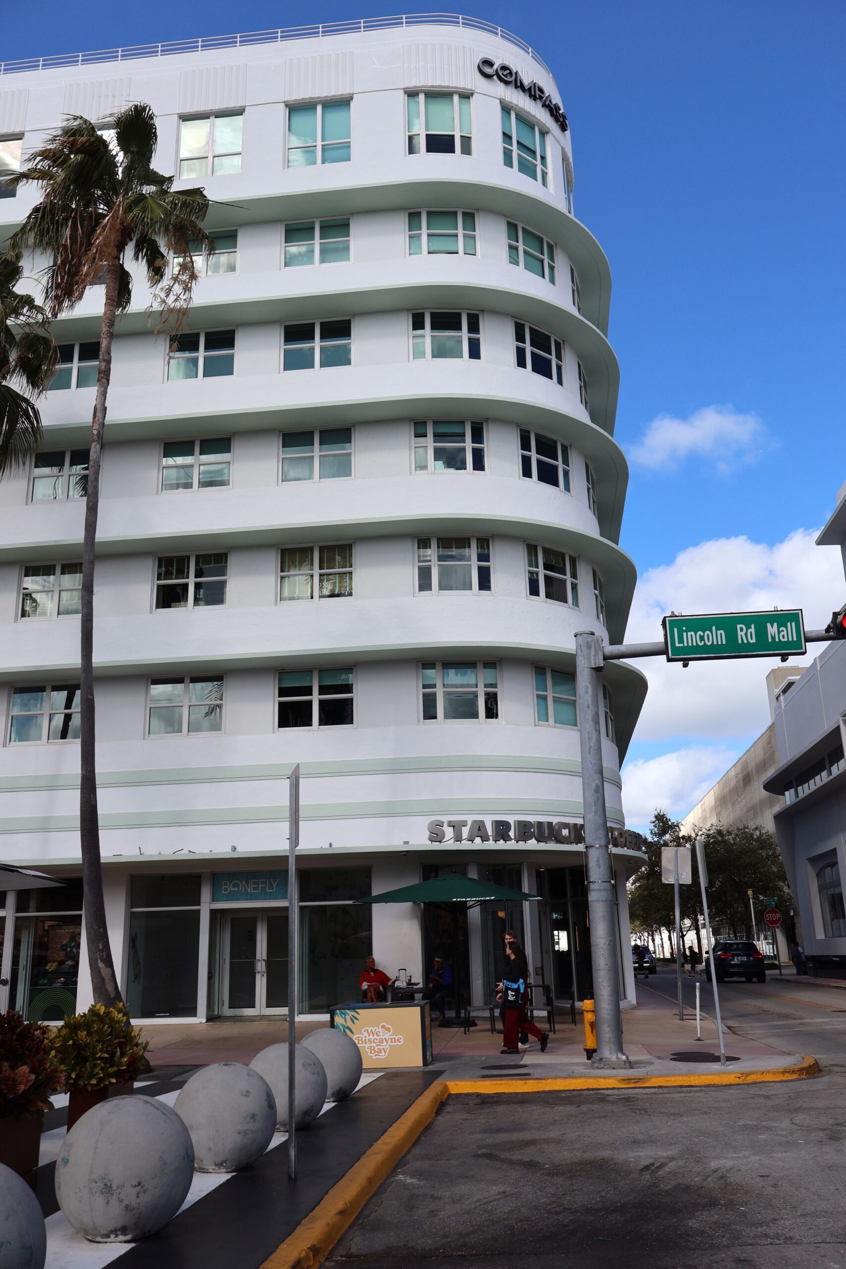 Art Deco architecture on Lincoln Road in Miami Beach with Starbucks storefront.