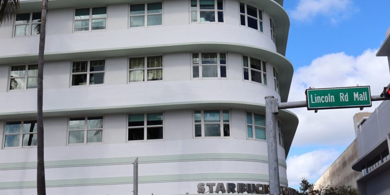 Art Deco architecture on Lincoln Road in Miami Beach with Starbucks storefront.